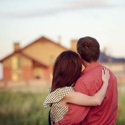 Couple looking at newly constructed home